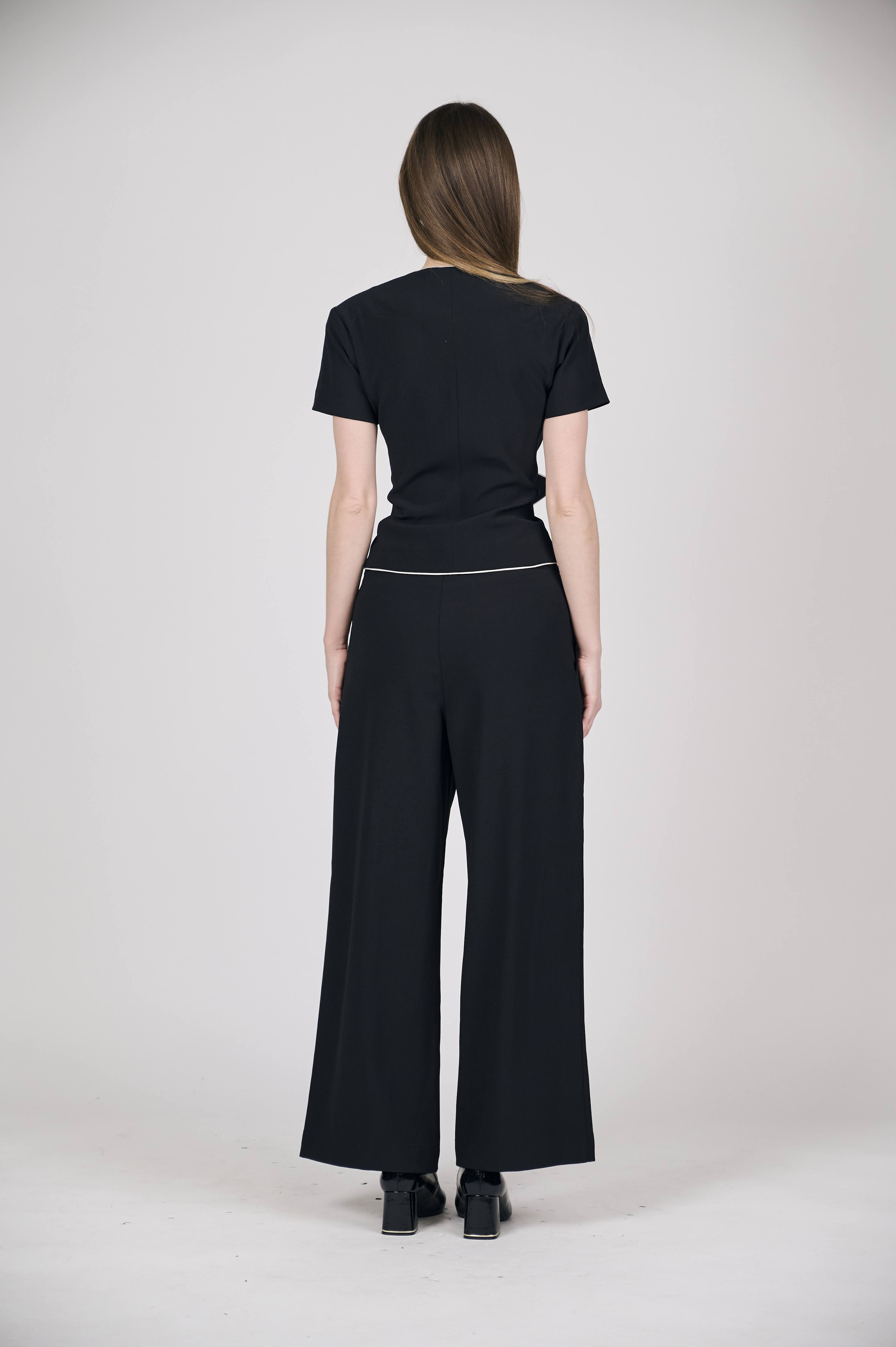 Sophisticated Black Peplum Bow Top with White Piping